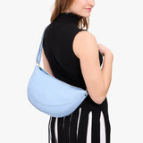 Skyway Large | Model wearing half circle shaped sling bag