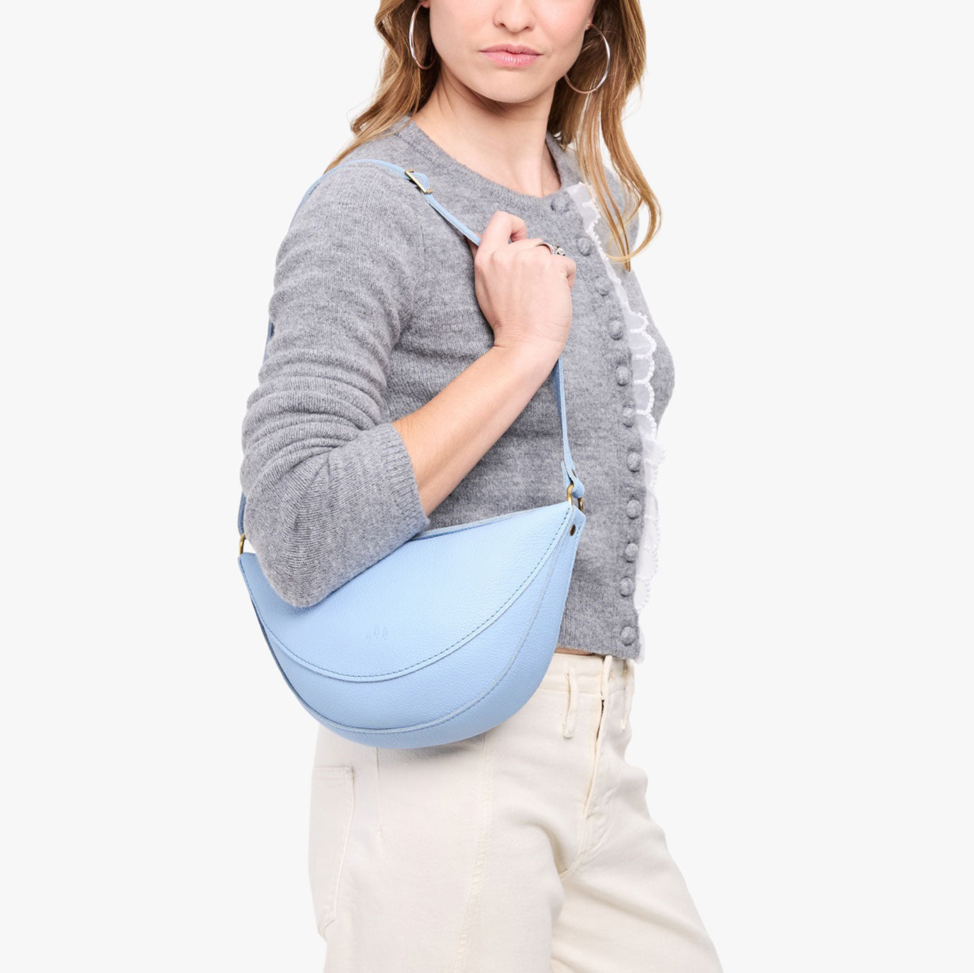 Skyway*Medium | Model wearing half circle shaped sling bag