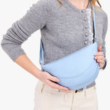 Skyway Medium | Model wearing half circle shaped sling bag