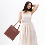 Sunkissed North/South | Structured large tote bag with overlapping panels and crossbody strap