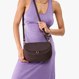 Moose Large | Model wearing a leather Crossbody with a flap and magnetic closure