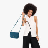 Planetary Large | Model wearing a leather Crossbody with a flap and magnetic closure