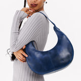 Cowboy Blue Large | Crescent shaped shoulder bag with zipper closure and adjustable strap