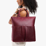 Cabernet Large | Model wearing a convertible tote clutch crossbody