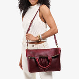 Cabernet Large | Model wearing a convertible tote clutch crossbody