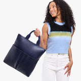 Cobalt Large | Model wearing a convertible tote clutch crossbody