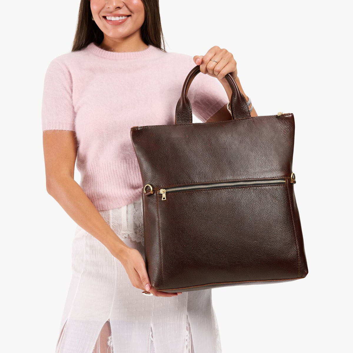 Coldbrew*Large | Model wearing a convertible tote clutch crossbody