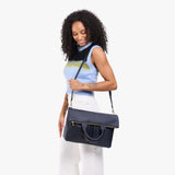 Night Owl Large | Model wearing a convertible tote clutch crossbody