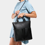 Pebbled--black Large | Model wearing a convertible tote clutch crossbody