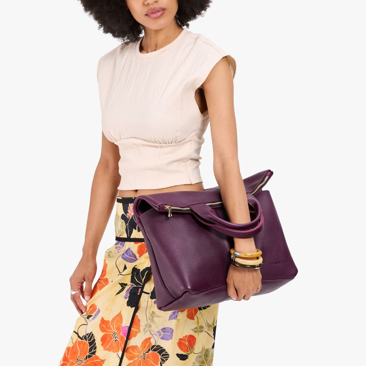Plum*Large | Model wearing a convertible tote clutch crossbody