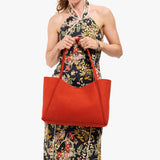 Paprika Large | Model holding midsize rectangular tote bag