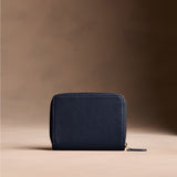 Anchor Blue | Wallet with card and storage pockets on a light brown background - back view