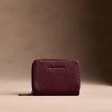 Hunter | Wallet with card and storage pockets on a light brown background