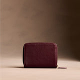 Hunter | Wallet with card and storage pockets on a light brown background - back view