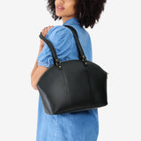 Black Large | Model holding a half circle crossbody bag with handles and removable crossbody strap 