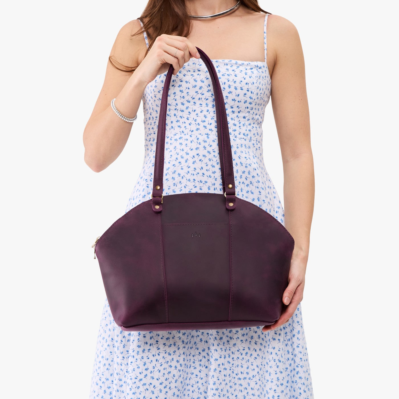 Larkspur*Large | Model holding a half circle crossbody bag with handles and removable crossbody strap 