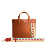 Comet Candy | Patterned fabric and leather strap on a white background 