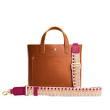 Safari | Patterned fabric and leather strap on a white background 