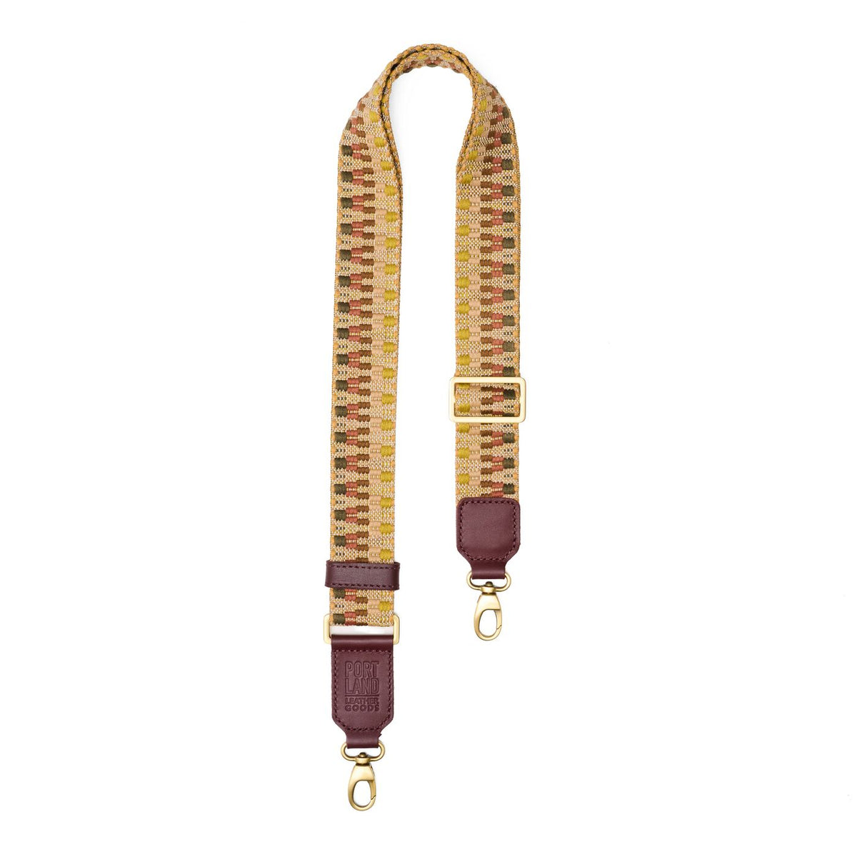 Sepia Blush | Patterned fabric and leather strap on a white background 