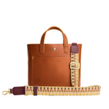 Sepia Blush | Patterned fabric and leather strap on a white background 