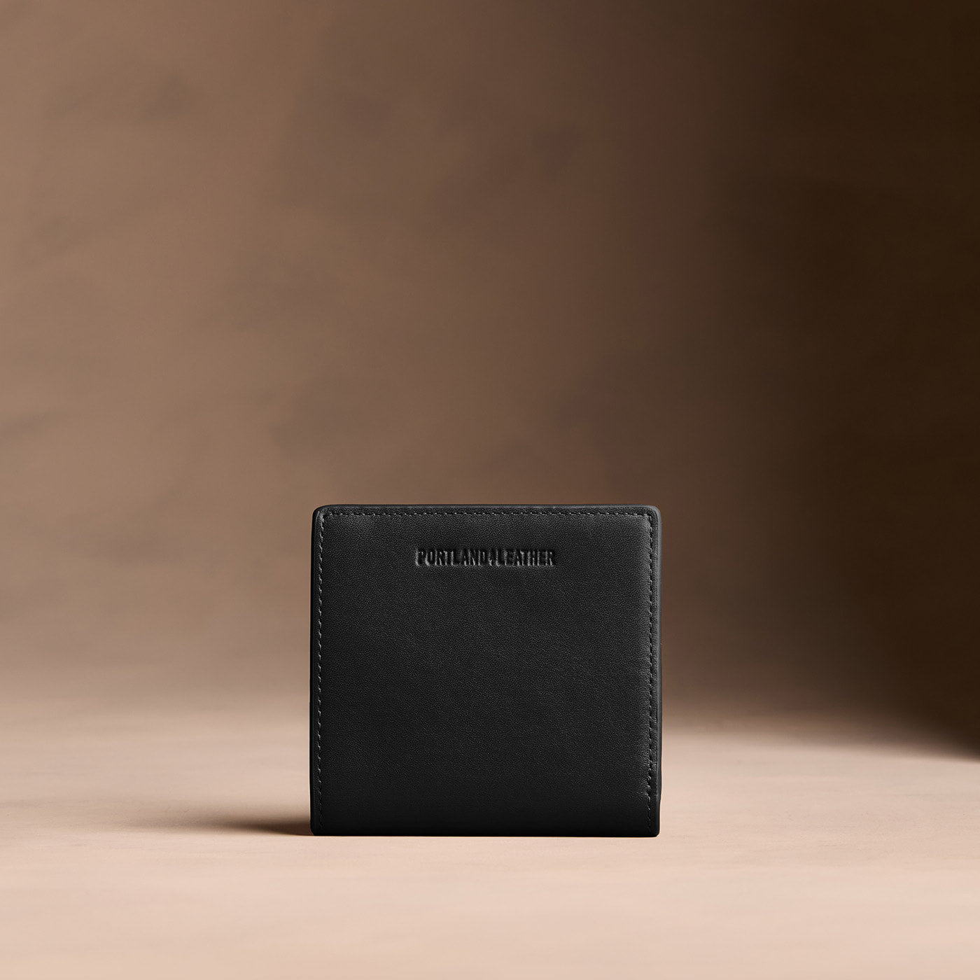Onyx*Small | Petite slim leather bifold wallet with multiple card slots and a zippered back pocket