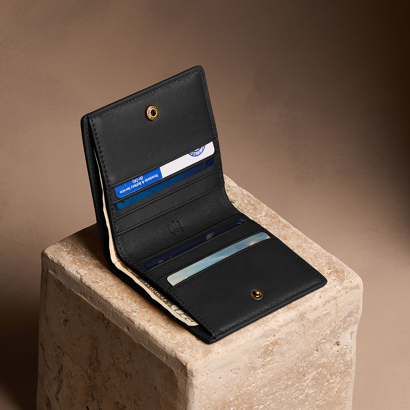 Onyx*Small | Petite slim leather bifold wallet with multiple card slots and a zippered back pocket