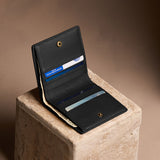 Onyx Small | Petite slim leather bifold wallet with multiple card slots and a zippered back pocket