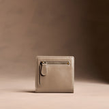 Satine Small | Petite slim leather bifold wallet with multiple card slots and a zippered back pocket
