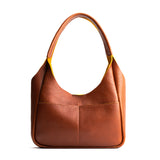 Sienna Medium | U-shaped, flat-bottomed leather shoulder bag with two outside pockets