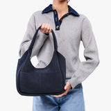 Alaska Blue Medium | U-shaped, flat-bottomed leather shoulder bag with two outside pockets