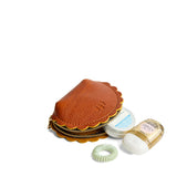 Sienna Small | Curved leather pouch with zipper and scalloped edges