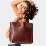 Cognac | Midsize crossbody tote with handles and a pocket