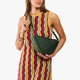 Evergreen Medium | Model wearing petite half circle shaped sling bag