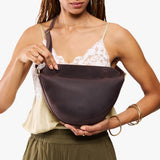 Moose Medium | Model wearing petite half circle shaped sling bag