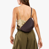 Moose Medium | Model wearing petite half circle shaped sling bag