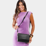 Black Medium | Model Holding Leather Crossbody Bag with Magnetic Messenger Bag Closure