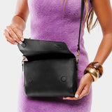 Black Medium | Model Holding Leather Crossbody Bag with Magnetic Messenger Bag Closure