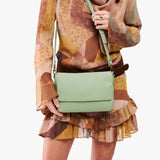 Pistachio Medium | Model Wearing Small Leather Crossbody Bag with Magnetic Messenger Bag Closure