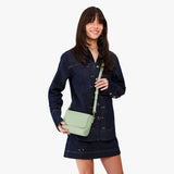 Pistachio Mini | Model Wearing Small Leather Crossbody Bag with Magnetic Messenger Bag Closure