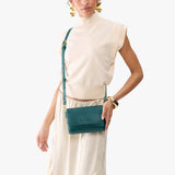 Sea Glass Mini | Model Wearing Small Leather Crossbody Bag with Magnetic Messenger Bag Closure