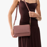 Sunkissed Medium | Model Holding Leather Crossbody Bag with Magnetic Messenger Bag Closure