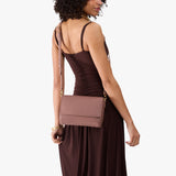 Sunkissed Medium | Model Wearing Leather Crossbody Bag with Magnetic Messenger Bag Closure
