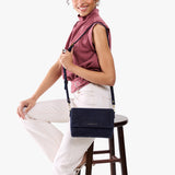 Velvet Blue Medium | Model Wearing Leather Crossbody Bag with Magnetic Messenger Bag Closure