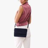 Velvet Blue Medium | Model Wearing Leather Crossbody Bag with Magnetic Messenger Bag Closure