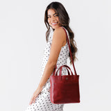 Chili Red Classic | Model wearing crossbody tote bag with snap closure and front pocket