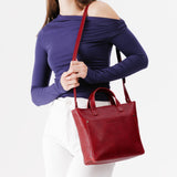 Chili Red Zipper | Model wearing crossbody tote bag with zipper closure and front pocket