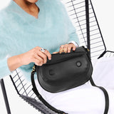 Black Large | Model wearing a leather Crossbody with a flap and magnetic closure