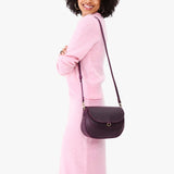 Larkspur Large | Model wearing a leather Crossbody with a flap and magnetic closure