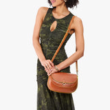 Sienna Large | Model wearing a leather Crossbody with a flap and magnetic closure