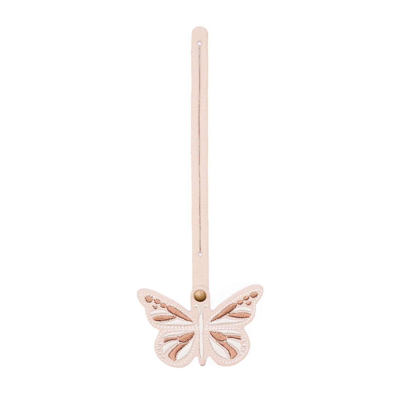 Oatmilk | Embroidered butterfly tassel accessory on a bag
